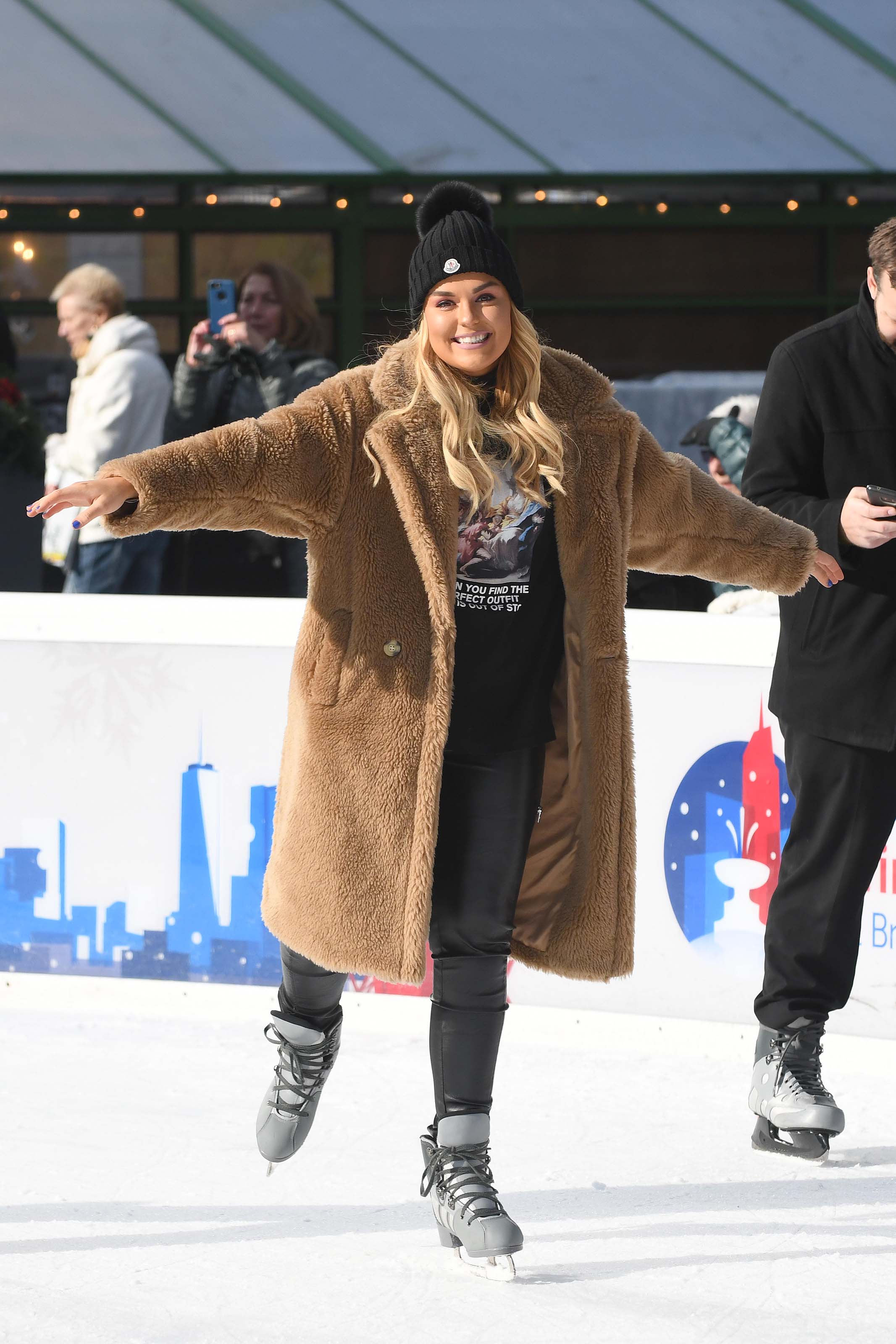 Tallia Storm ice skating in Bryant Park