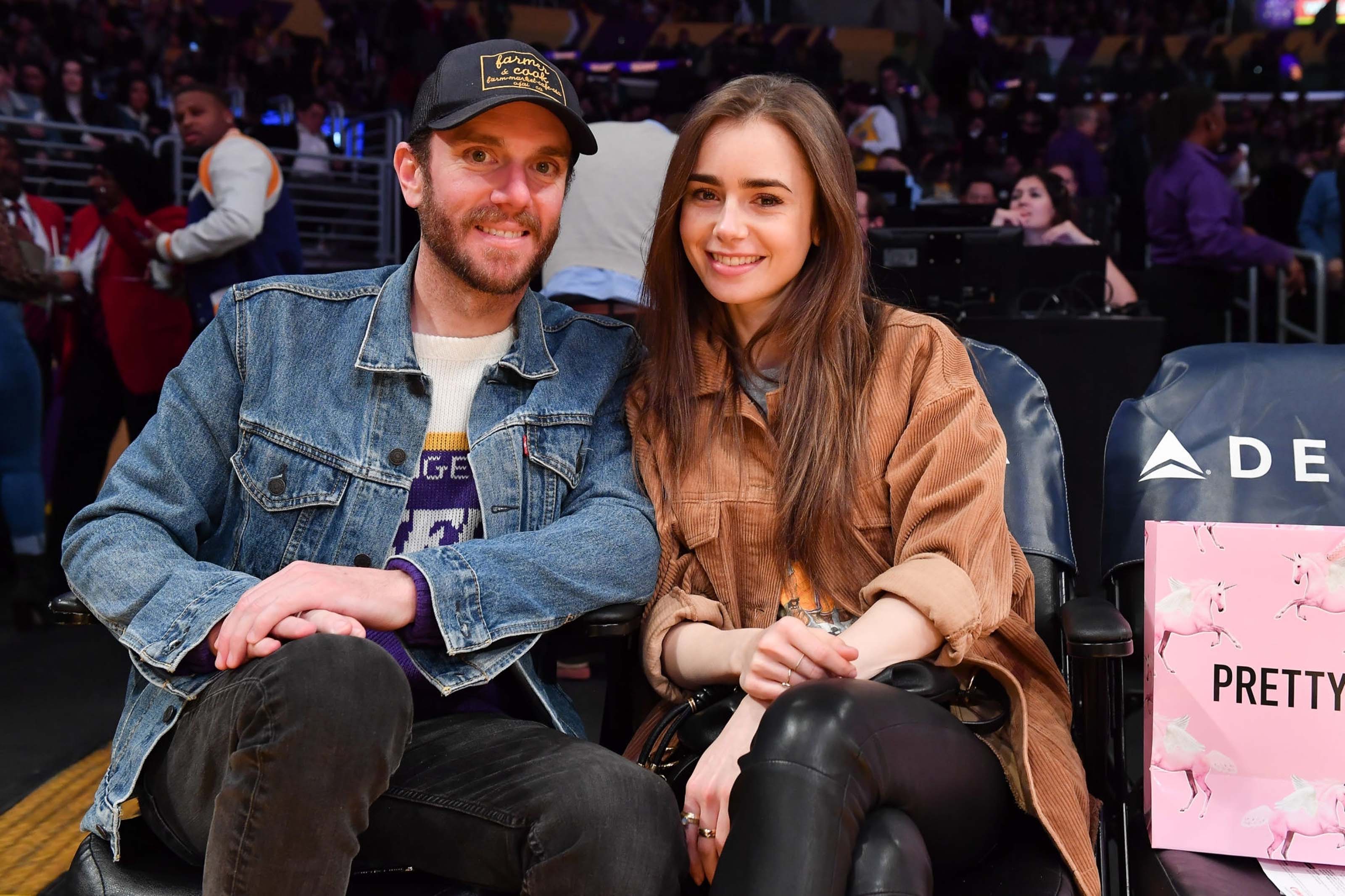 Lily Collins at a Los Angeles Lakers game