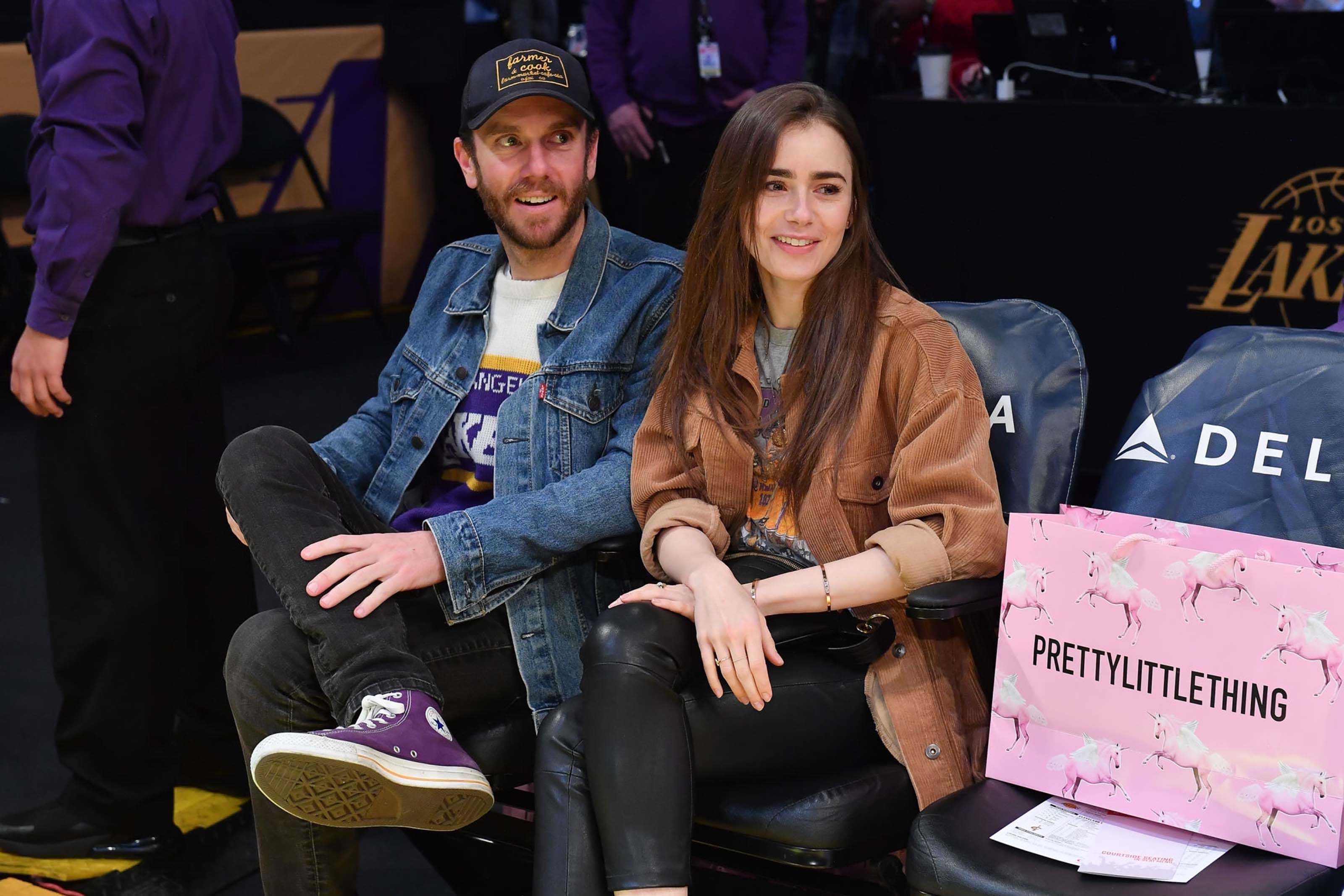 Lily Collins at a Los Angeles Lakers game