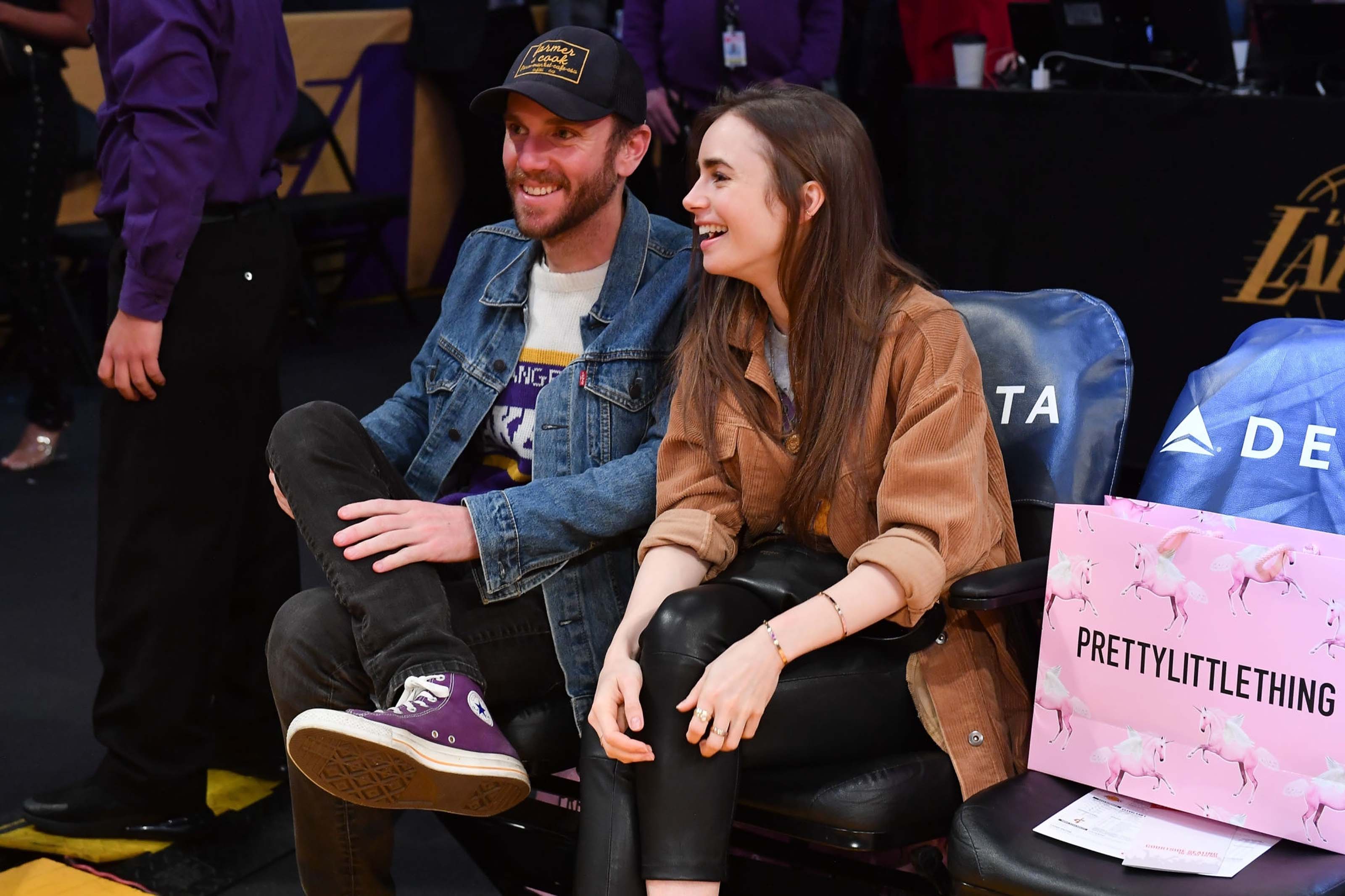 Lily Collins at a Los Angeles Lakers game