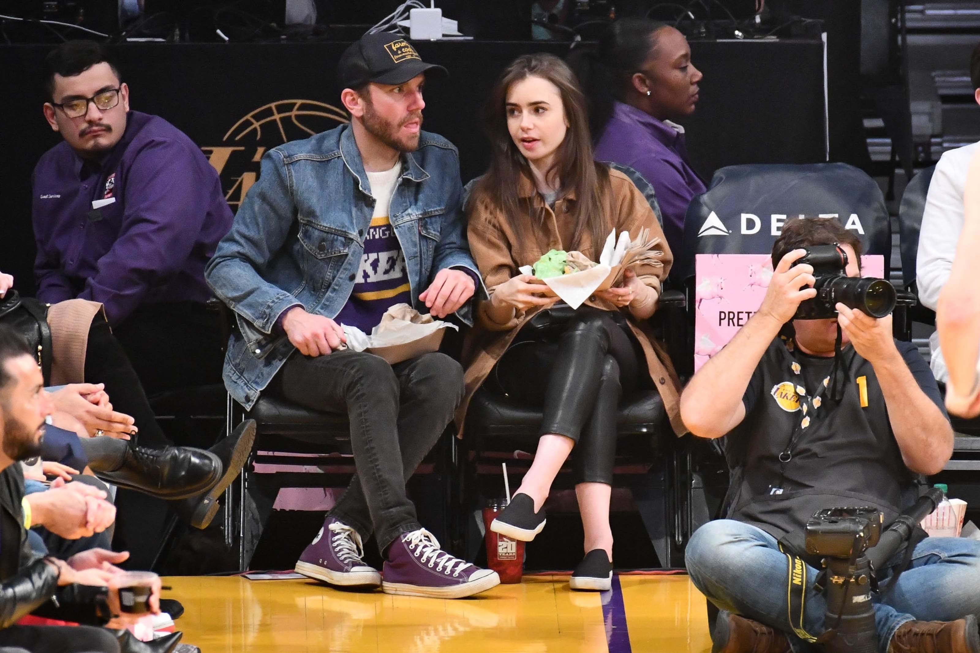 Lily Collins at a Los Angeles Lakers game