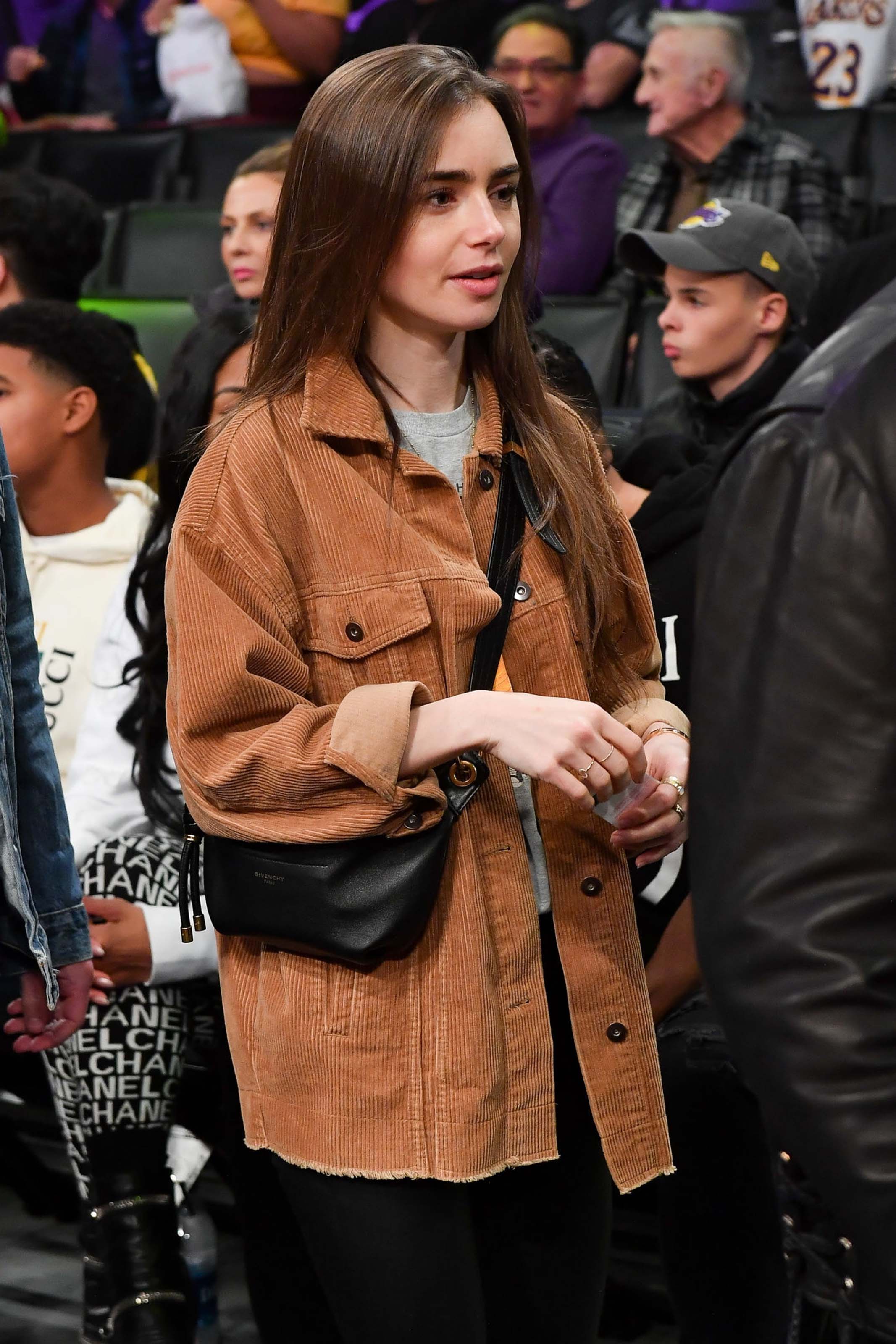 Lily Collins at a Los Angeles Lakers game