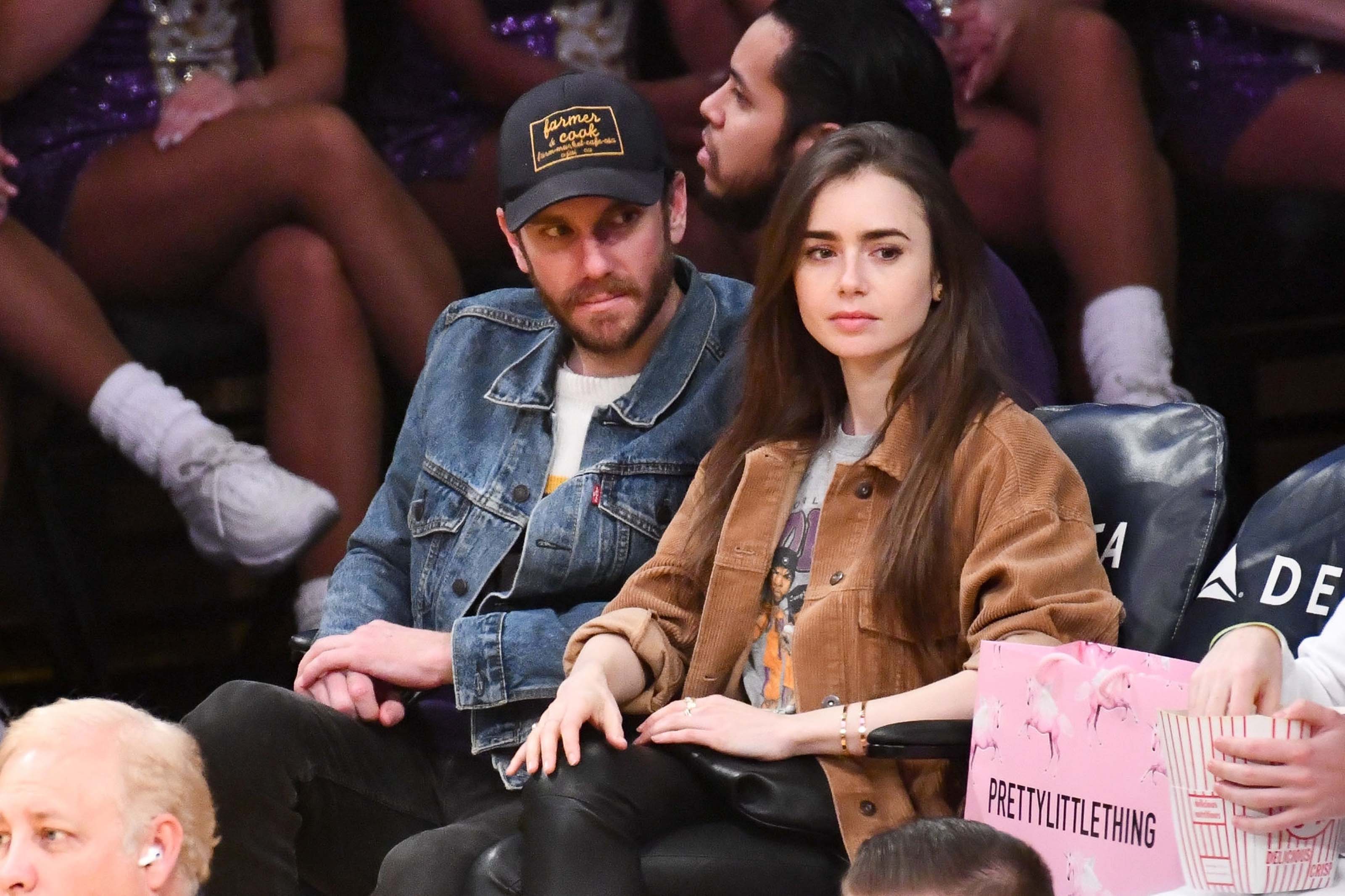 Lily Collins at a Los Angeles Lakers game