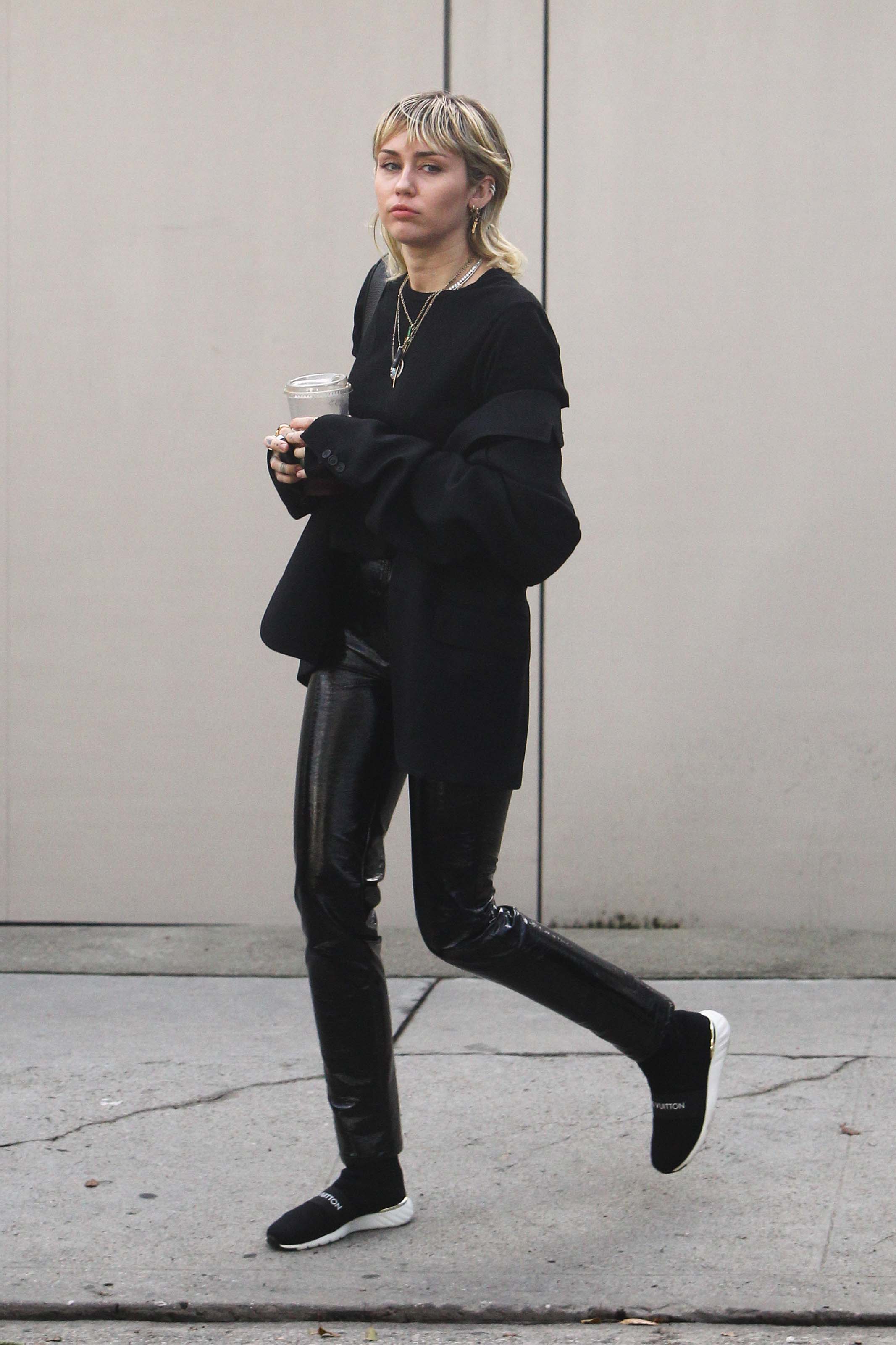 Miley Cyrus arrives at a studio