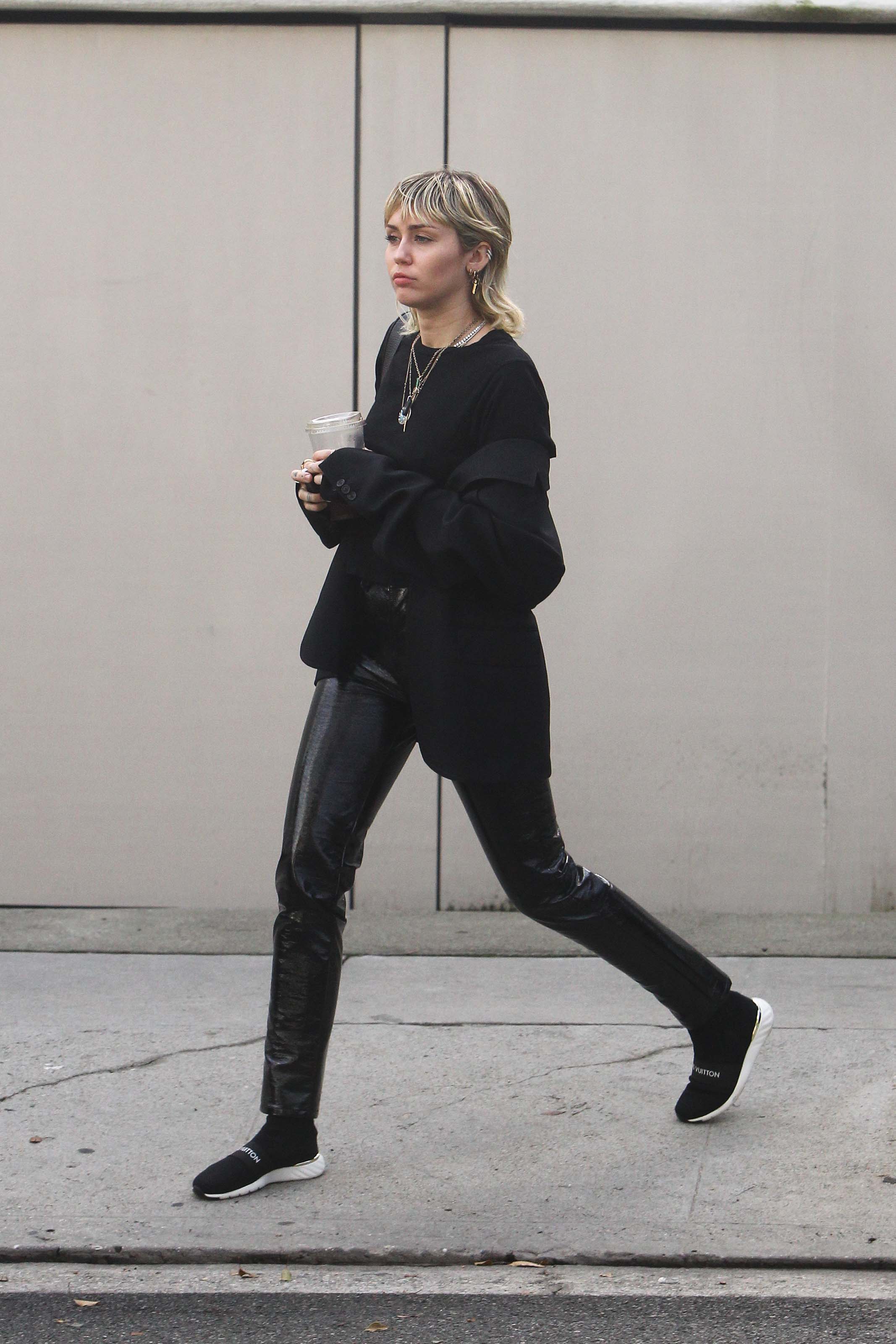 Miley Cyrus arrives at a studio