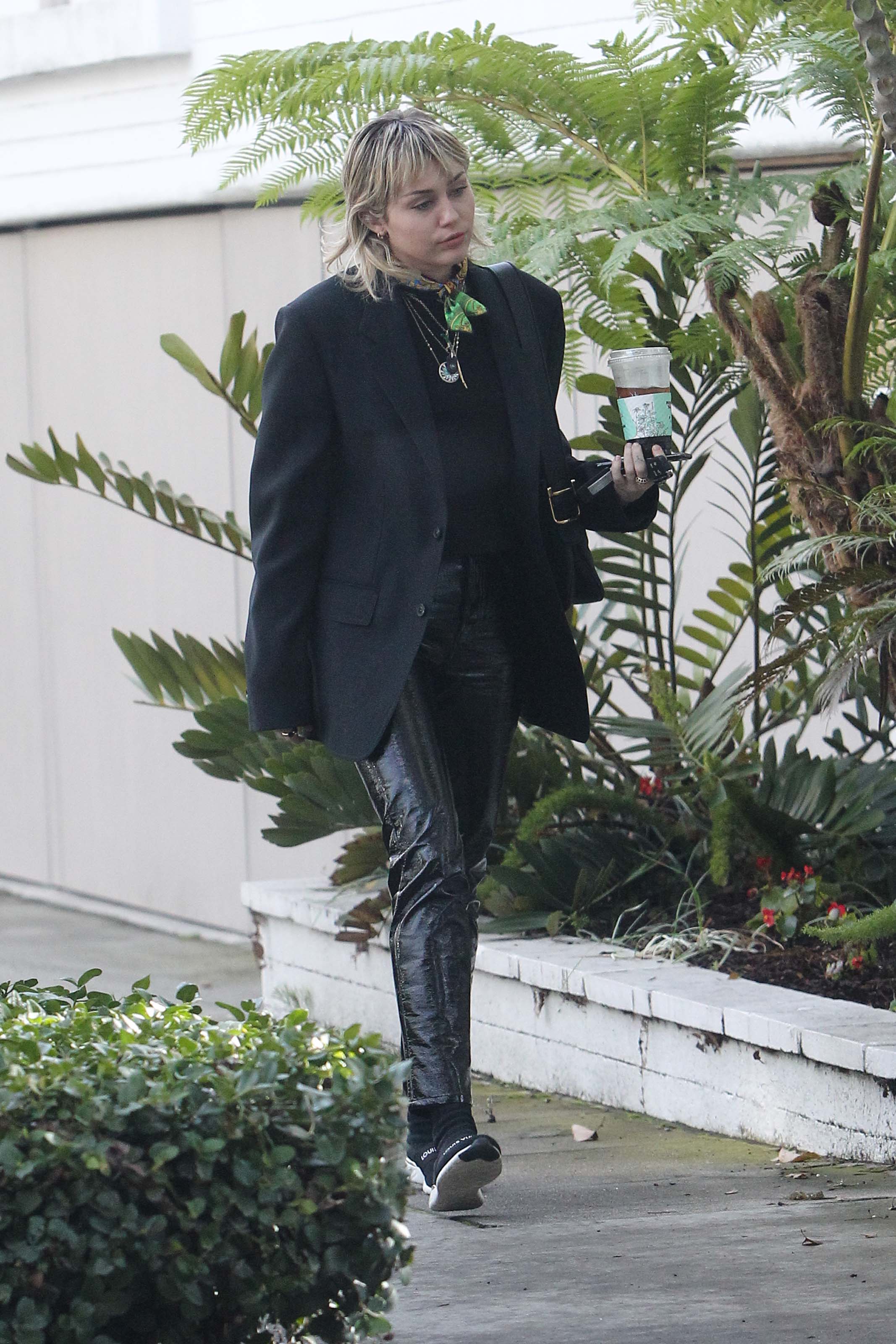 Miley Cyrus arrives at a studio