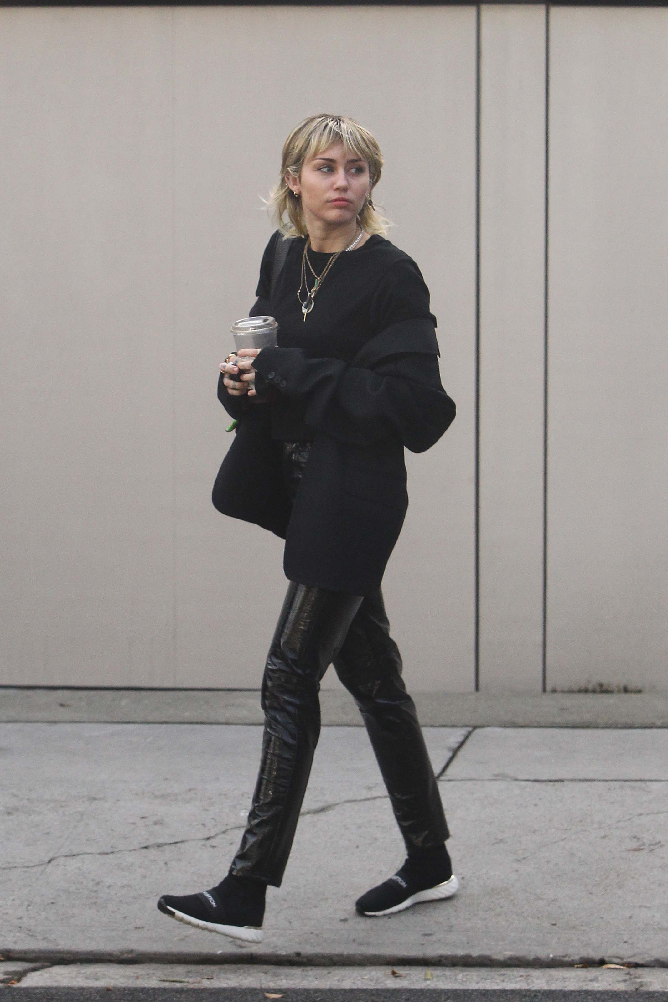 Miley Cyrus arrives at a studio