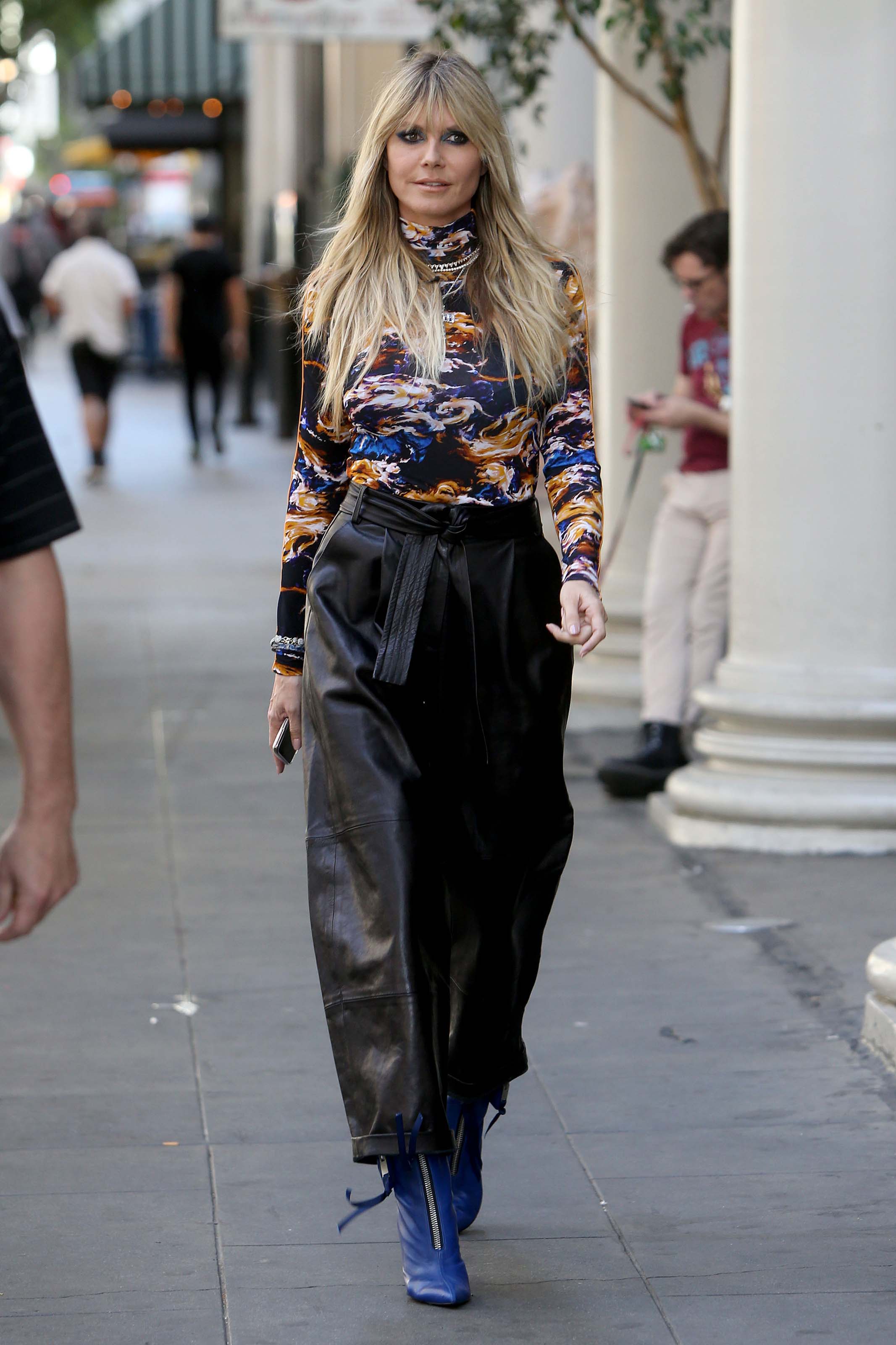 Heidi Klum walking to the Germany’s Next Topmodel set