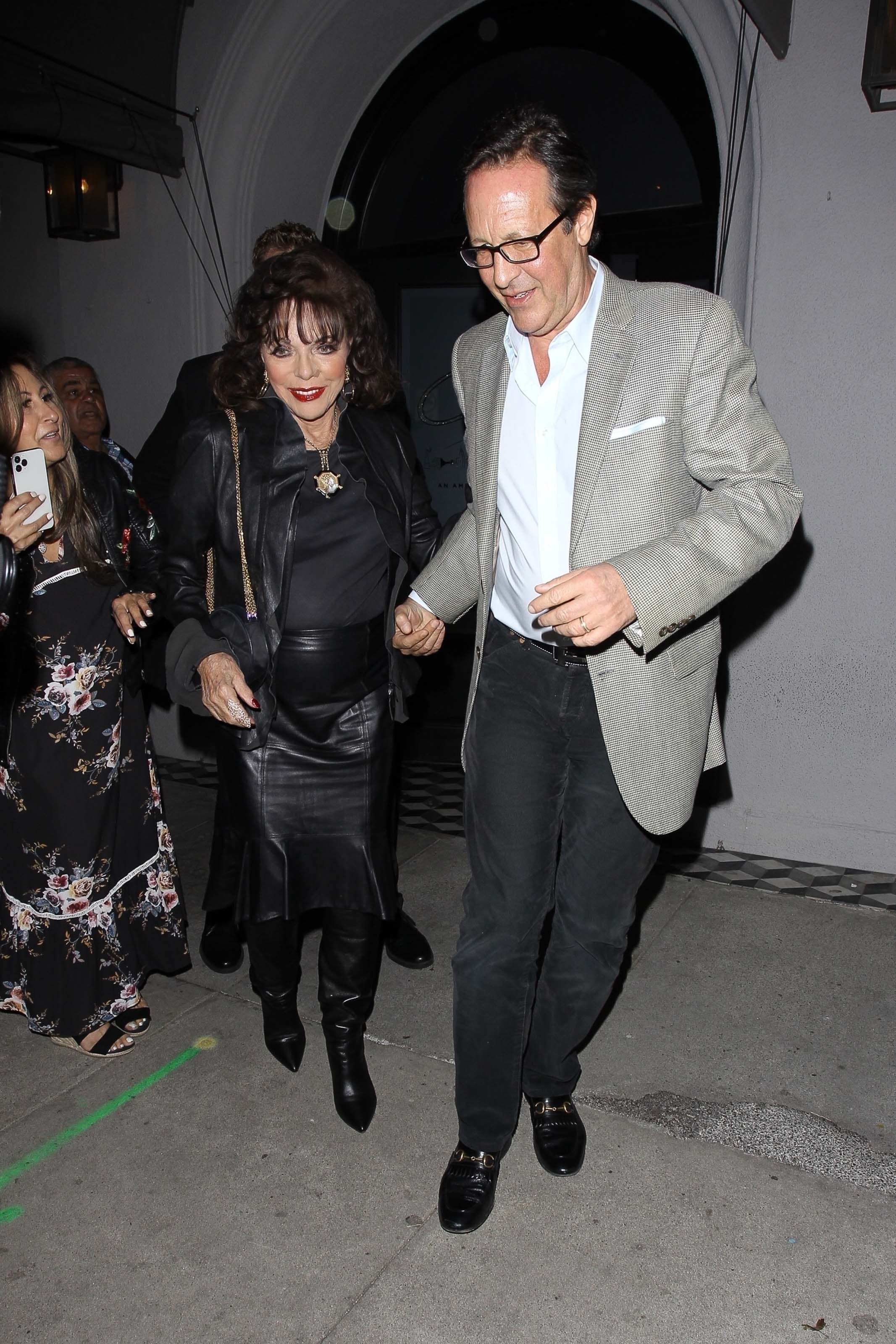 Joan Collins and Percy Gibson enjoy a dinner date