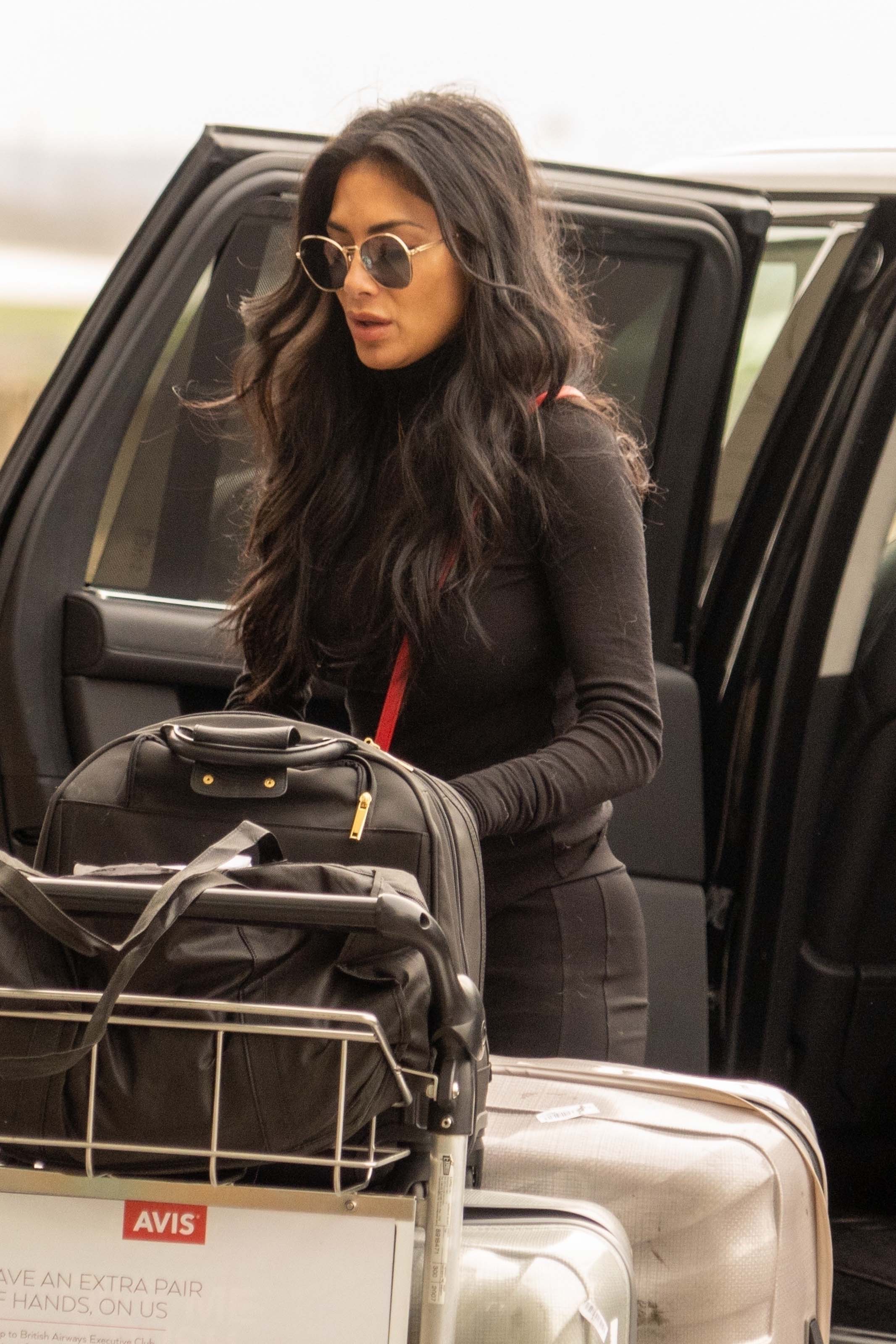 Nicole Scherzinger at Heathrow Airport