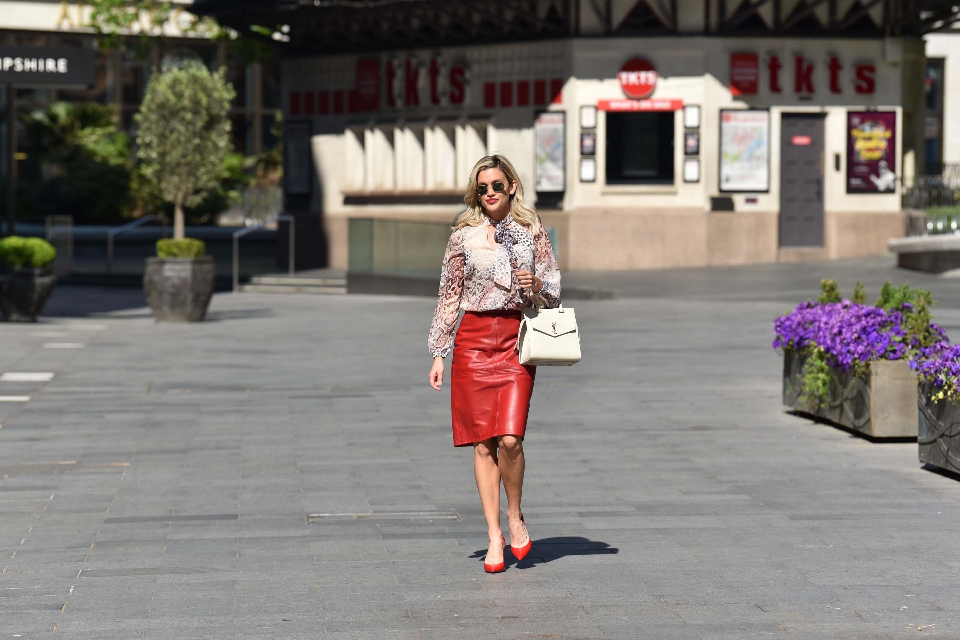 Ashley Roberts looks chic in pencil skirt and print top while leaving the Global studios