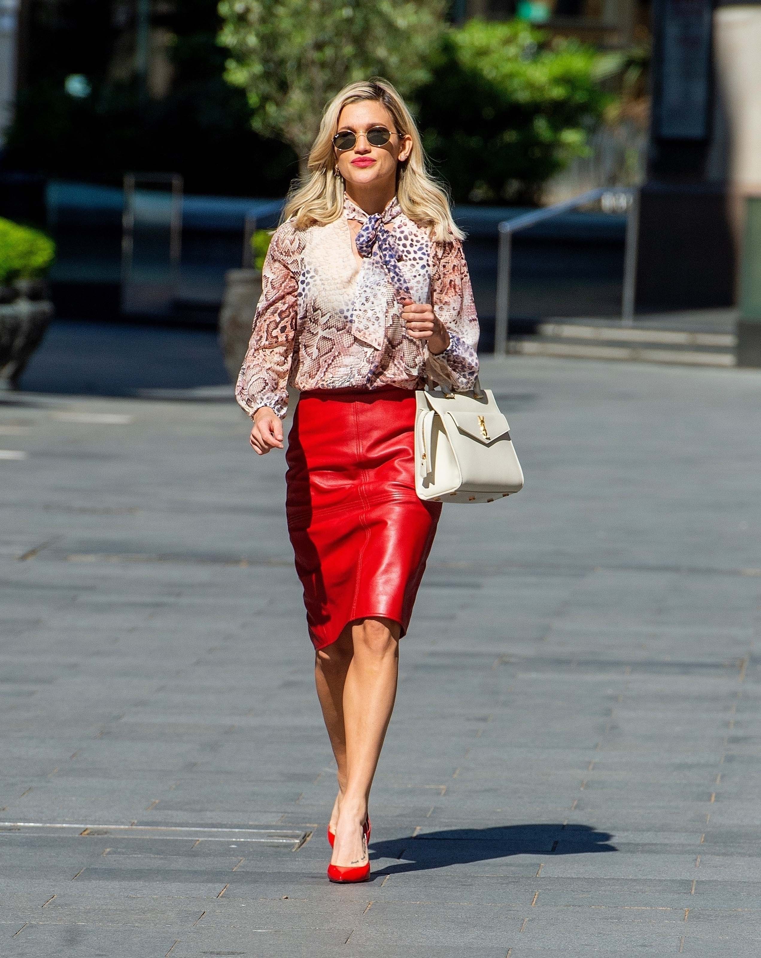 Ashley Roberts looks chic in pencil skirt and print top while leaving the Global studios