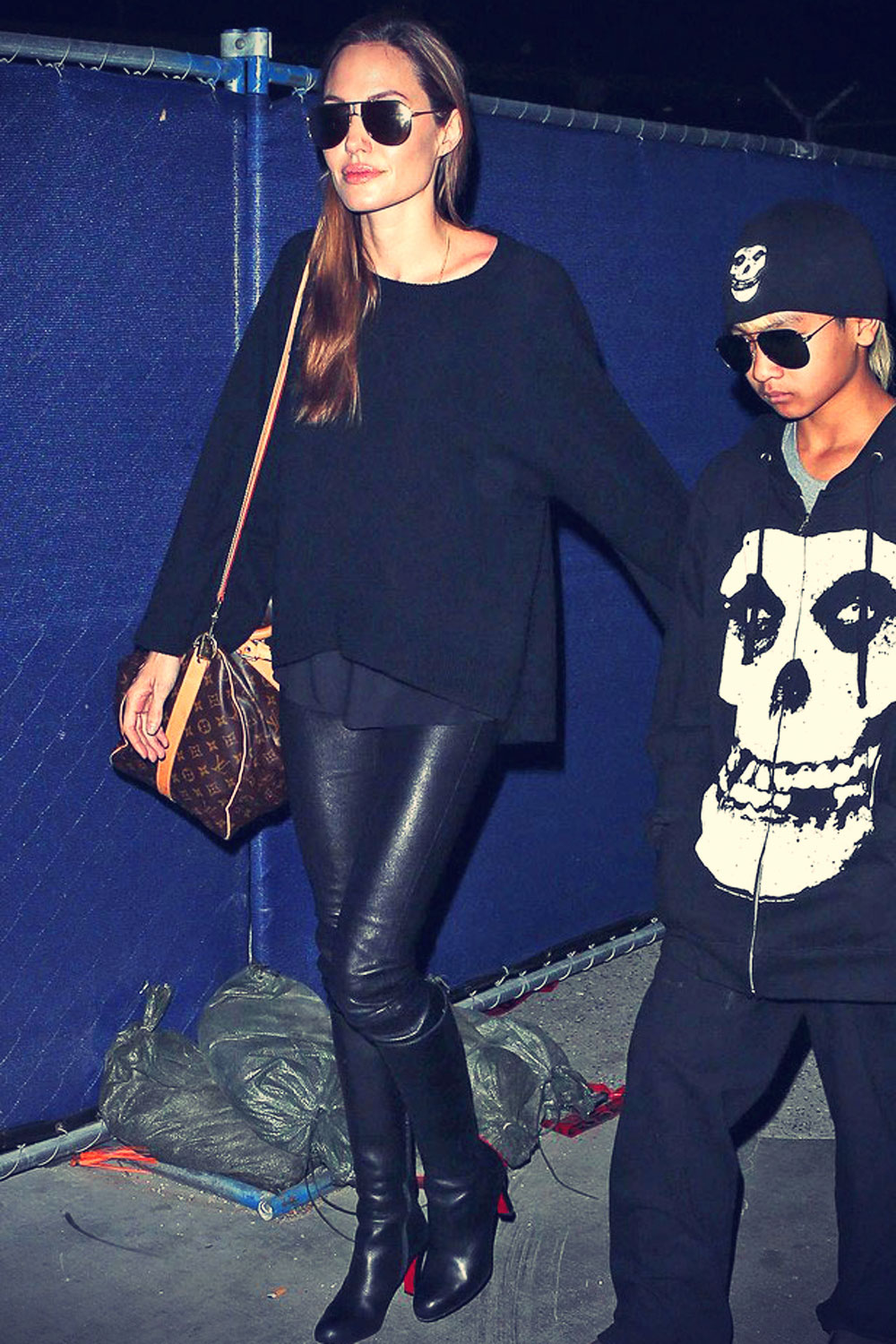 Angelina Jolie rocks leather pants while arriving at LAX Airport