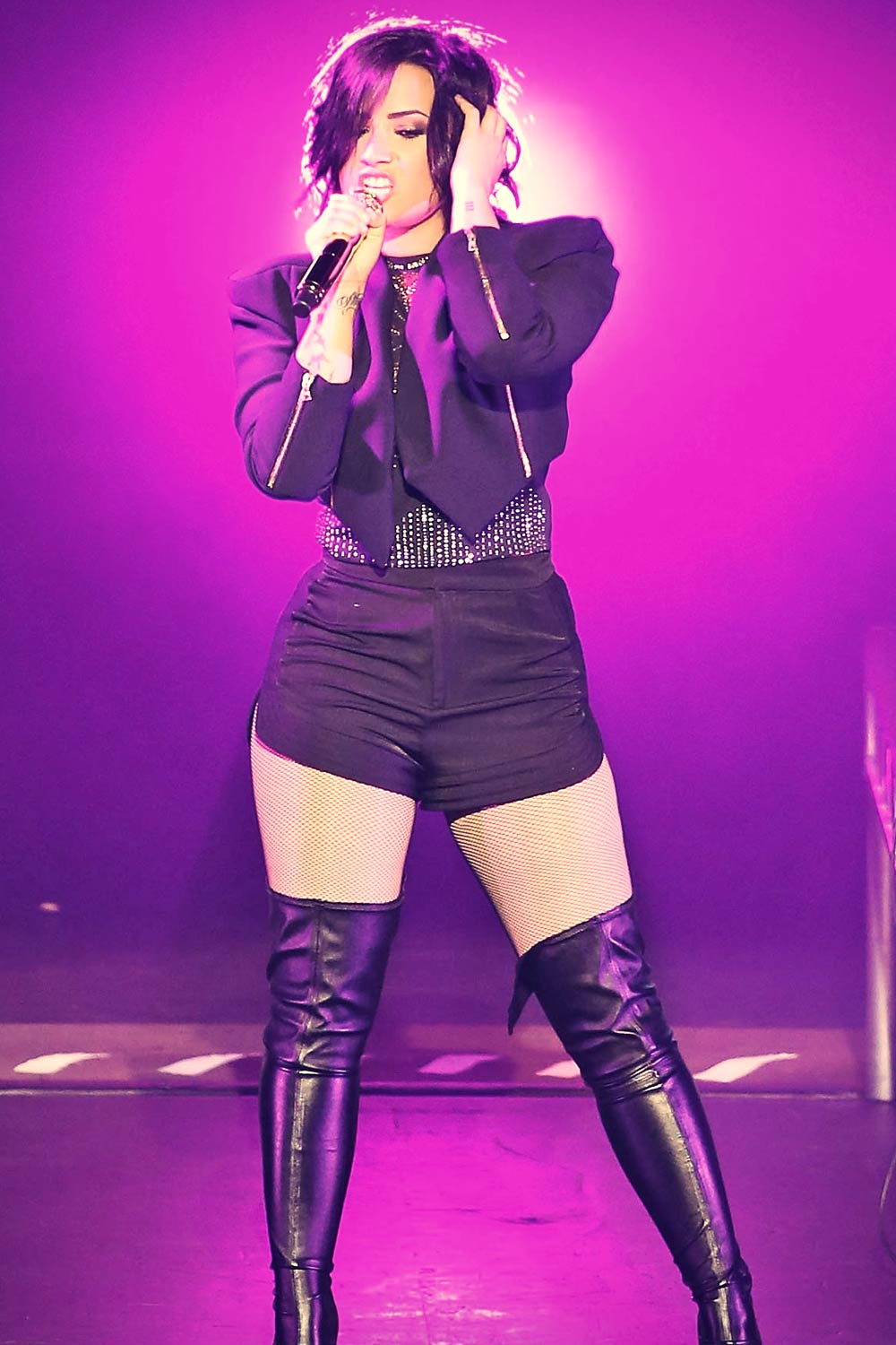 Demi Lovato performing at the Crowne Theatre