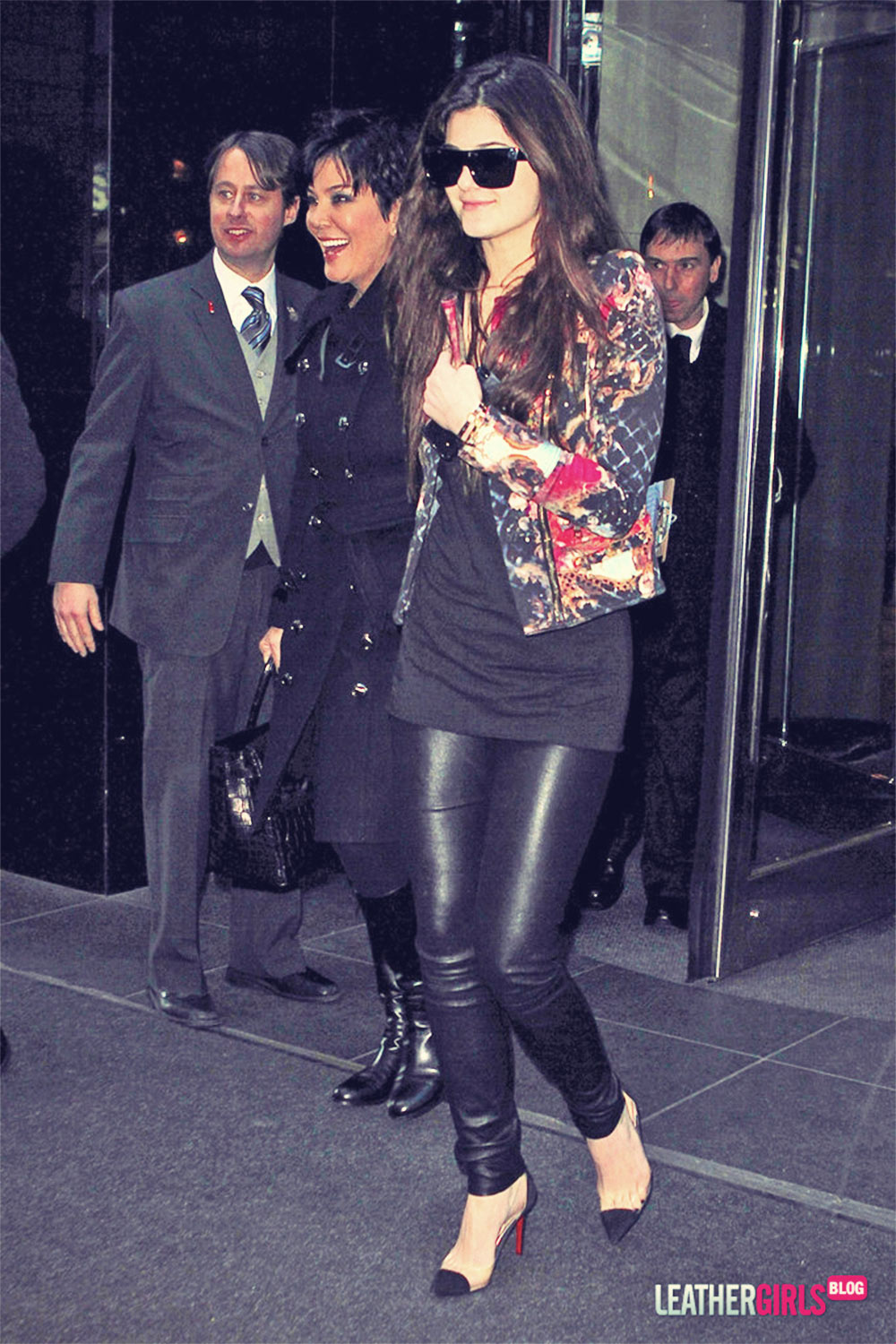 Kendall Jenner hides behind a friend while leaving her hotel in NYC Hotel