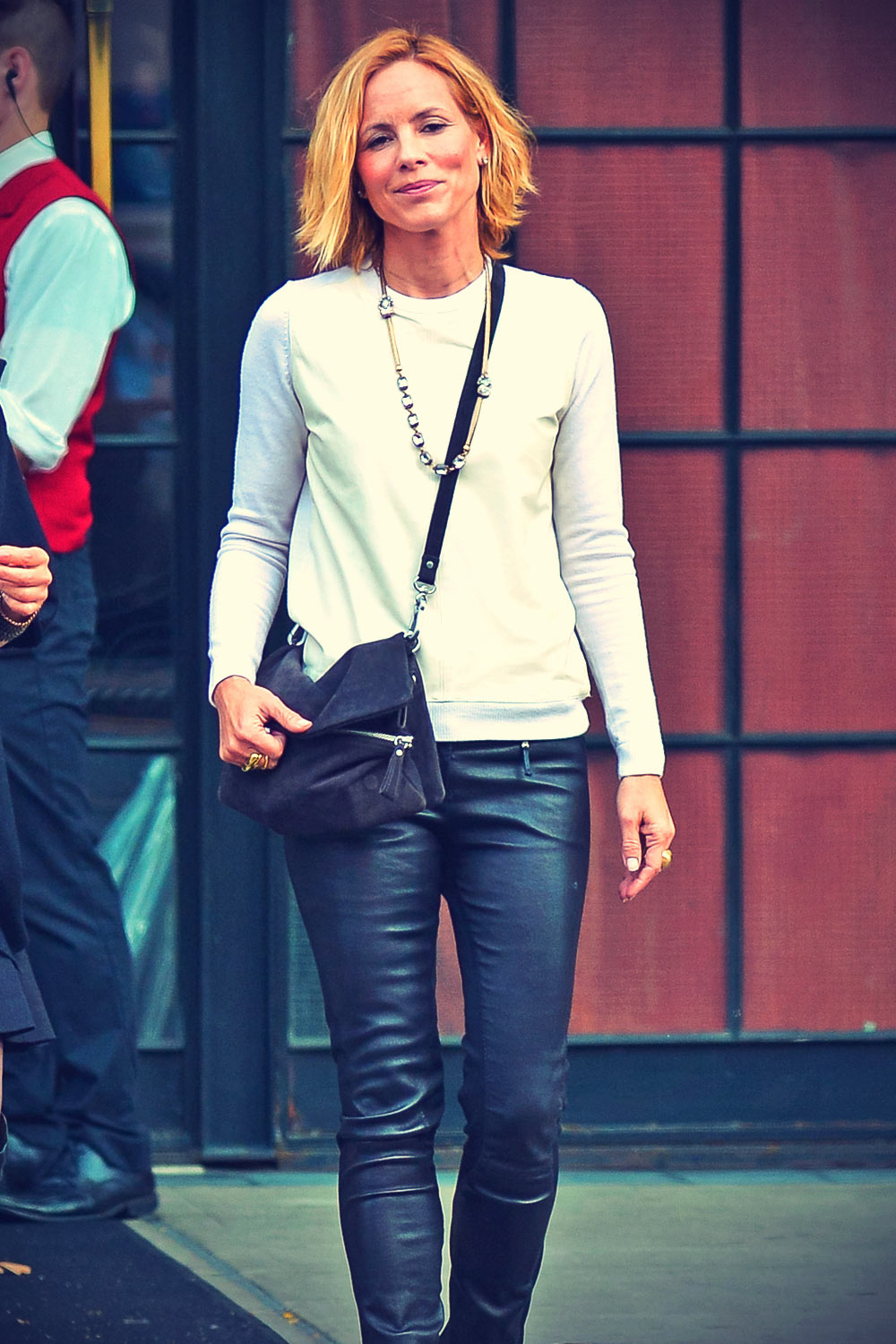 Maria Bello waits for cab outside a building in downtown Manhattan