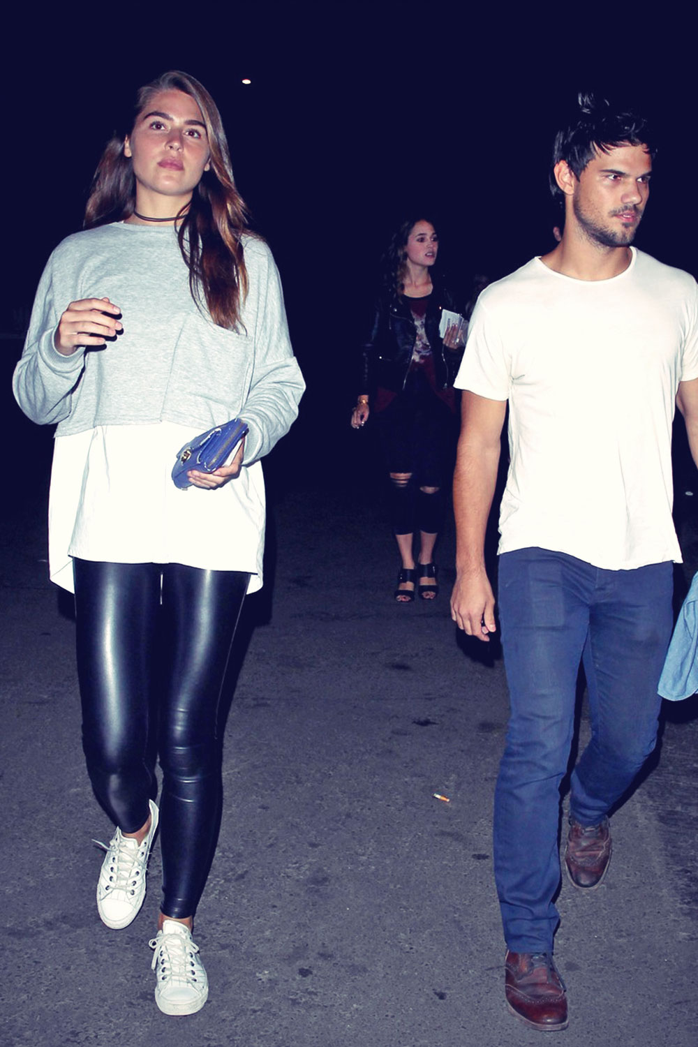 Marie Avgeropoulos and her boyfriend Taylor Lautner attend the Drake vs Lil Wayne concert