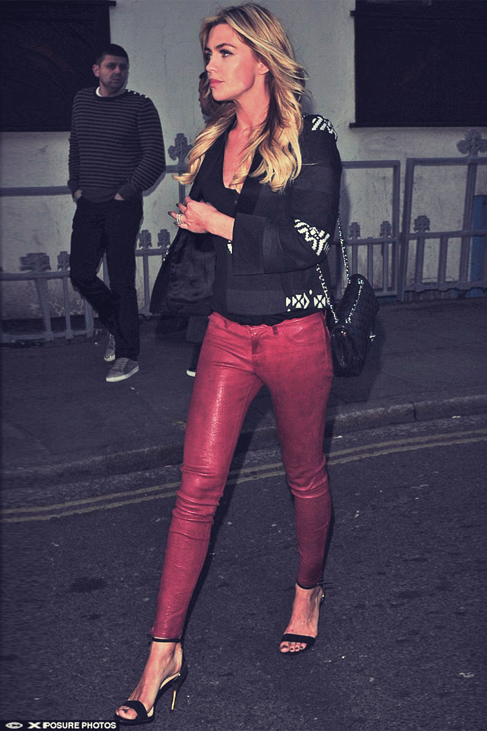 Abbey Clancy rocks red leather pants